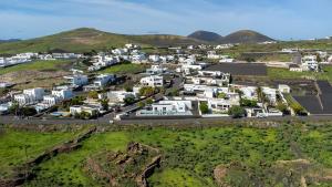an aerial view of a village in the hills at Casa Conil Private 25m Heated Pool with Hydraulic Mobility Lift in Conil +41 photos