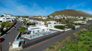 an aerial view of a street with houses and a mountain at Casa Conil Private 25m Heated Pool with Hydraulic Mobility Lift in Conil