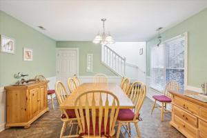 a dining room with a table and chairs at 4620 - Flip Flop Inn in Southern Shores +34 photos