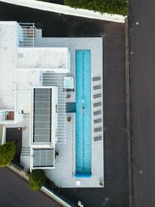 an overhead view of a building with a blue door at Casa Conil Private 25m Heated Pool with Hydraulic Mobility Lift in Conil
