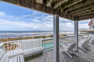 a porch with two chairs and the ocean at 2869 - Seascape in Duck