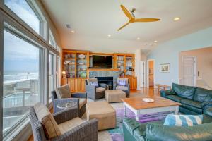 a living room with a couch and a table at 2869 - Seascape in Duck +53 photos