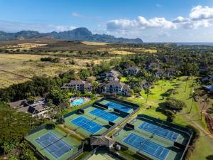 an aerial view of a mansion with several tennis courts at Kahala 312 in Kipu