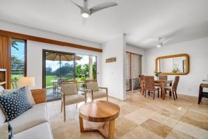 a living room with a couch and a table at Kahala 312 in Kipu