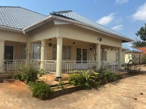 a small house with a porch at MableHomestay in Mzuzu