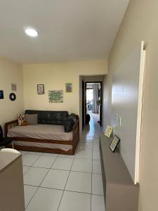 a living room with a bed and a couch at Flat 1218, no residencial monte castelo in Bezerros +46 photos