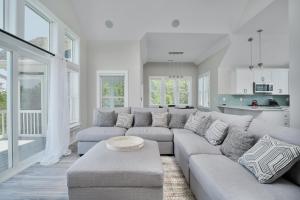 a living room with a couch and a table at 4918 - Stress Less in Kitty Hawk