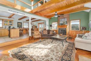 a living room with a couch and a table at 7657 - Dragon's Lair in Avon