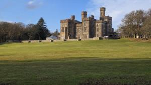 an old castle on a large grassy field at 1 Bed in Reef oc-r30134 in Uig