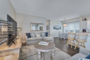 a living room with a couch and a table at 7660 - Robyn's Nest in Avon