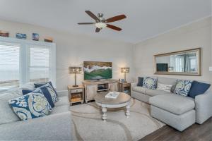 a living room with a couch and a ceiling fan at 7660 - Robyn's Nest in Avon