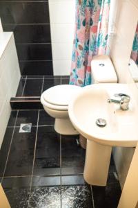 a bathroom with a toilet and a sink at Ektoras House in Platamonas