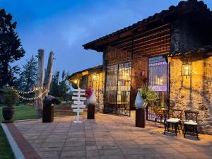 a building with a sign in front of it at Hotel Monumento Hacienda de Amoltepec in Zacatlán