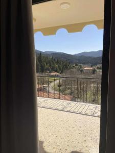 a view from the balcony of a house at Village House by nature in Karkaloú +3 photos