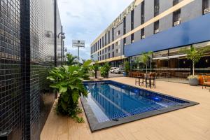 a swimming pool in the middle of a building at Amazon Park Hotel in Belém
