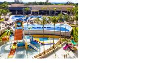 a resort pool with a slide and a water park at Apartamento em Olímpia in Olímpia +5 photos