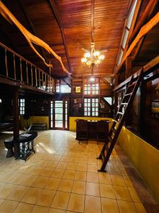 a room with a wooden ceiling and a table and chairs at Beyond Paradise Vacation Rental in Cristo Rey