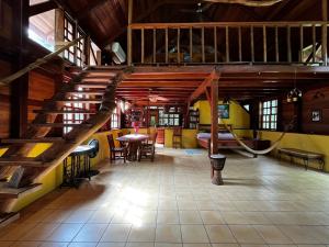 a room with a staircase and a hammock in it at Beyond Paradise Vacation Rental in Cristo Rey +4 photos