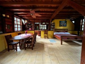 a room with a table and a bed and a bedroom at Beyond Paradise Vacation Rental in Cristo Rey