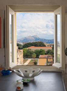 a large window with a view of a city at Terrazze Ginevra in Palermo