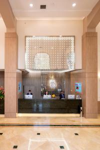 a lobby of a hotel with people sitting at desks at Hotel Dann Carlton Medellín in Medellín