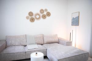 a living room with a couch and a table at Design Apartment - Solingen-Mitte - Balkon - BRIGHT Collection in Solingen +14 photos