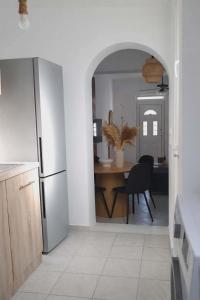 a kitchen with a table and a dining room at LD Home in Lixouri +10 photos