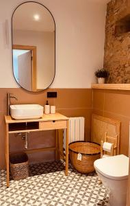 a bathroom with a sink and a mirror at Alojamiento Rural Montseny in Breda +63 photos