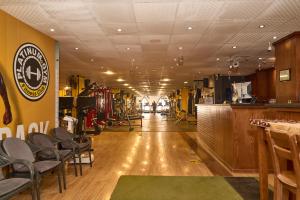 a long hallway with chairs and a bar in a store at The Fit Stop Hostel in Hurghada