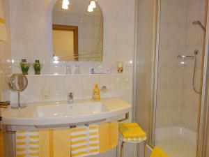 a bathroom with a sink and a shower at Ferienwohnungen Auhaus in Bad Reichenhall +41 photos