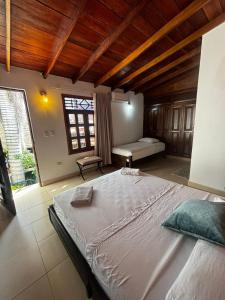 a bedroom with a large bed in a room at Hotel La Palma Centro Histórico in Santa Marta
