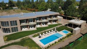 an aerial view of a house with a swimming pool at Howard Johnson Alcántara Boutique Hotel Chacras de Coria, Mendoza in Chacras de Coria