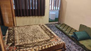 a room with a couch with a rug on it at الشريف in Irbid