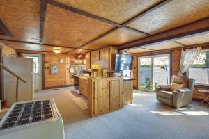 a kitchen with a refrigerator and a couch in a room at Rustic Poland Vacation Rental w/ Waterfront Deck! in Poland