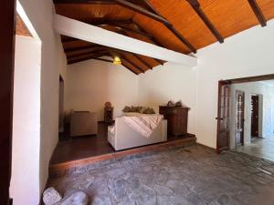 a living room with a couch and a wooden ceiling at Casona san isidro in Vicuña +68 photos