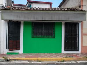 a green wall on the side of a building at Casa Verde in Granada