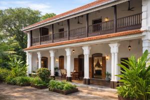 an exterior view of a house with a balcony at Agwe Villa - Hikkaduwa in Dodanduwa