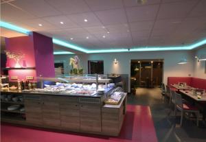 a restaurant with a buffet line with tables and chairs at L2R La Ferté sous Jouarre in La Ferté-sous-Jouarre +24 photos