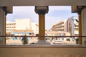 a view of a city street from a window at The Fit Stop Hostel in Hurghada