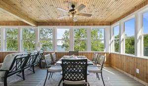 a dining room with a ceiling fan and a table and chairs at 43 Making Memories in Leesburg +19 photos