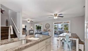 a kitchen with a sink and a table with chairs at 43 Making Memories in Leesburg