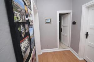 a hallway with a wall of pictures on the wall at Amasra Kerem Apart in Amasra +5 photos