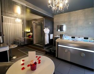 a kitchen with a table with red hearts on it at Luxury & Love - Professional Jaccuzzi and Spa in Chelles