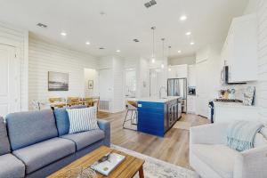a living room with a couch and a table at The Fairway Farmhouse in Port Aransas