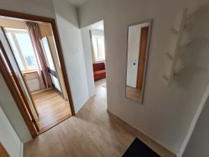 an empty room with a hallway with a mirror at Kuressaare kesklinn, Turu Apartment in Kuressaare