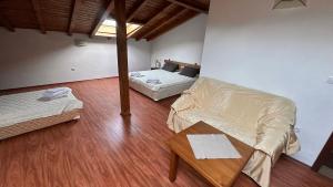 a living room with a couch and a table at Kulata Predel in Razlog