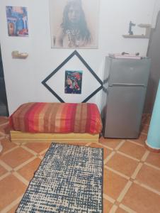 a room with a rug next to a refrigerator at Marrakesh Classic House 20 in Marrakesh
