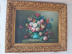 a painting of a vase of flowers in a gold frame at Marrakesh Classic House 20 in Marrakesh