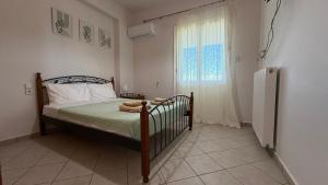 a bedroom with a bed and a window at KAZARMA Luxury House in Pilikáta