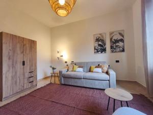a living room with a couch and a table at I sogni di Elias in Tuoro sul Trasimeno